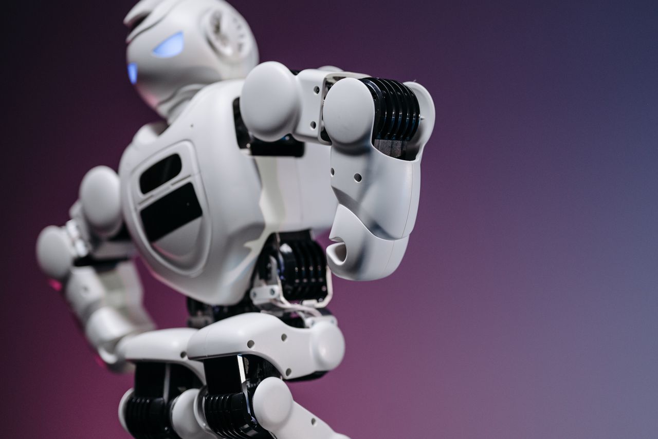 about-us Close-up of a futuristic white robot showcasing innovation and design.